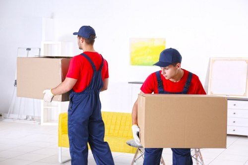 Removal team planning flat removals in Bayswater outside an apartment building