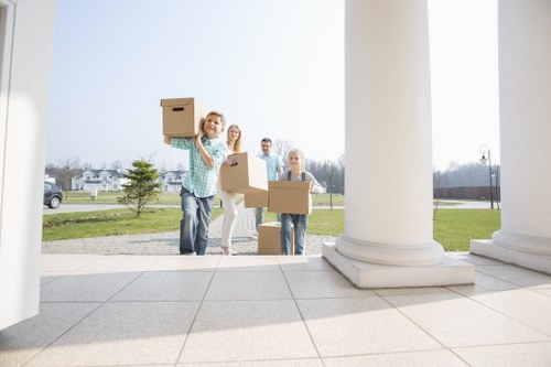 Professional movers carrying boxes during a Bayswater relocation