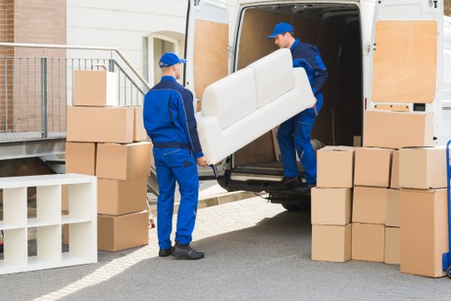 Home removal services in Bayswater moving furniture from an apartment