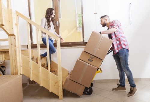Residential furniture removals in Bayswater with a moving truck outside a home