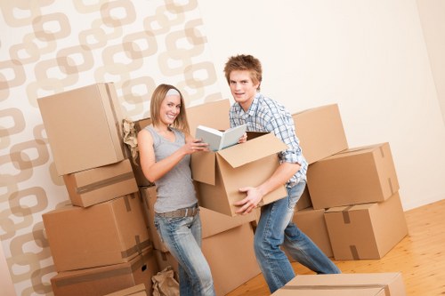 Packed moving boxes and furniture prepared for flat removals in Bayswater
